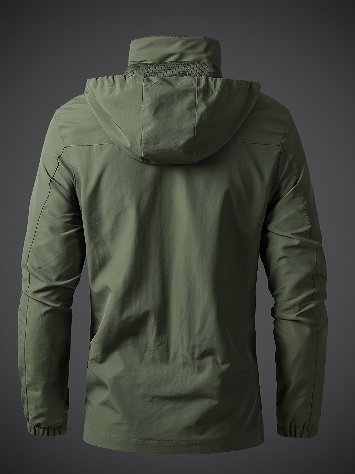 Men's lightweight hooded polyamide jacket with zipper closure and polyester lining, ideal for hiking and outdoor activities in the spring/fall season.