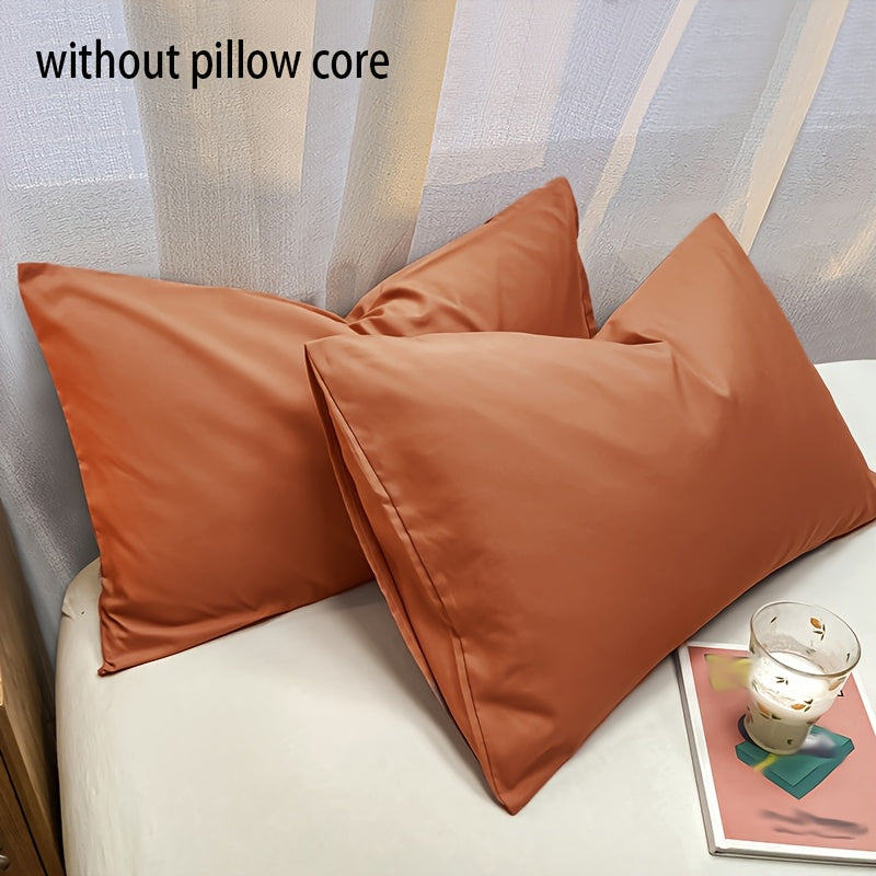 Basic set of 2 rectangular pillowcases made of 90g solid color fleece material, featuring an envelope closure design. These pillowcases are ultra soft, breathable, and machine washable, suitable for use in bedrooms, guest rooms, hotels, and more. The