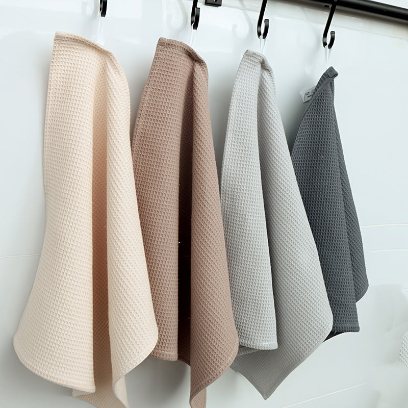 4 pieces of thickened waffle weave dish towels for household kitchen cleaning, absorbent and in mixed colors.