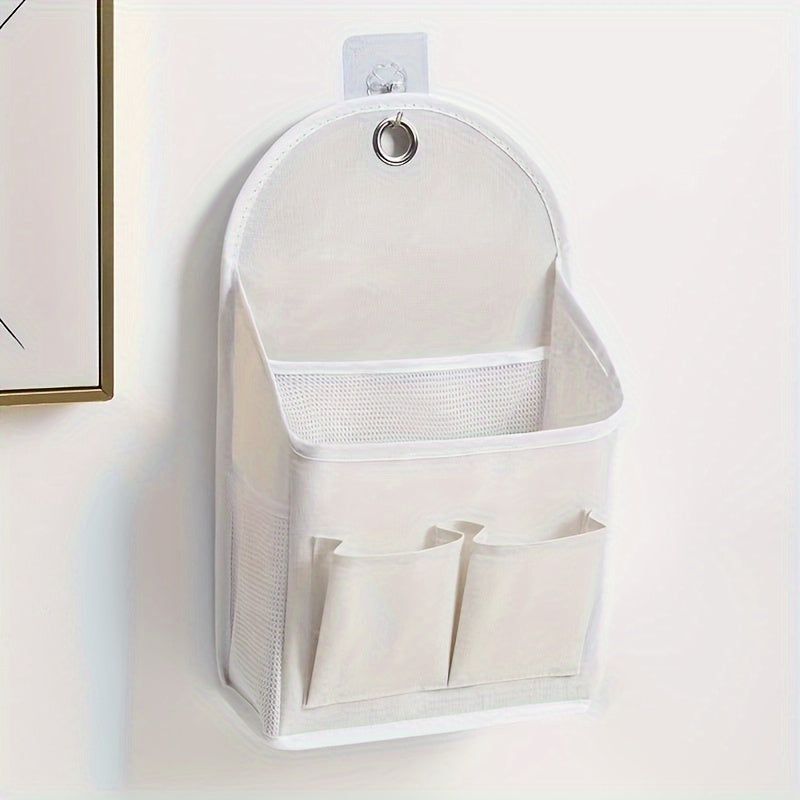 Wall-mounted storage organizer with dual pockets and mesh side compartment, ideal for dorms, wardrobes, homes, and offices. Comes in beige and grey, made of other materials.