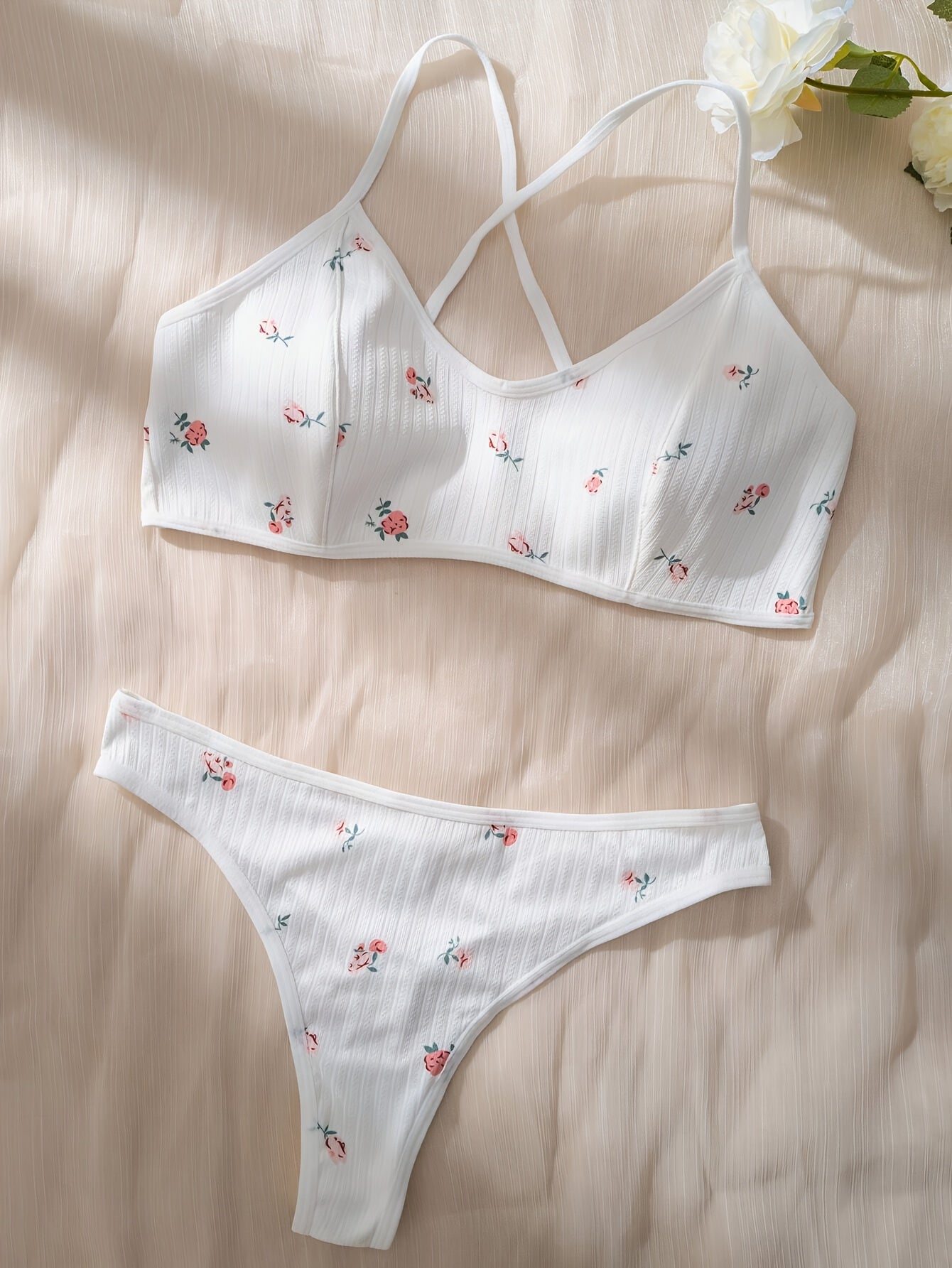 Stylish floral print lingerie set with cross straps, for women.