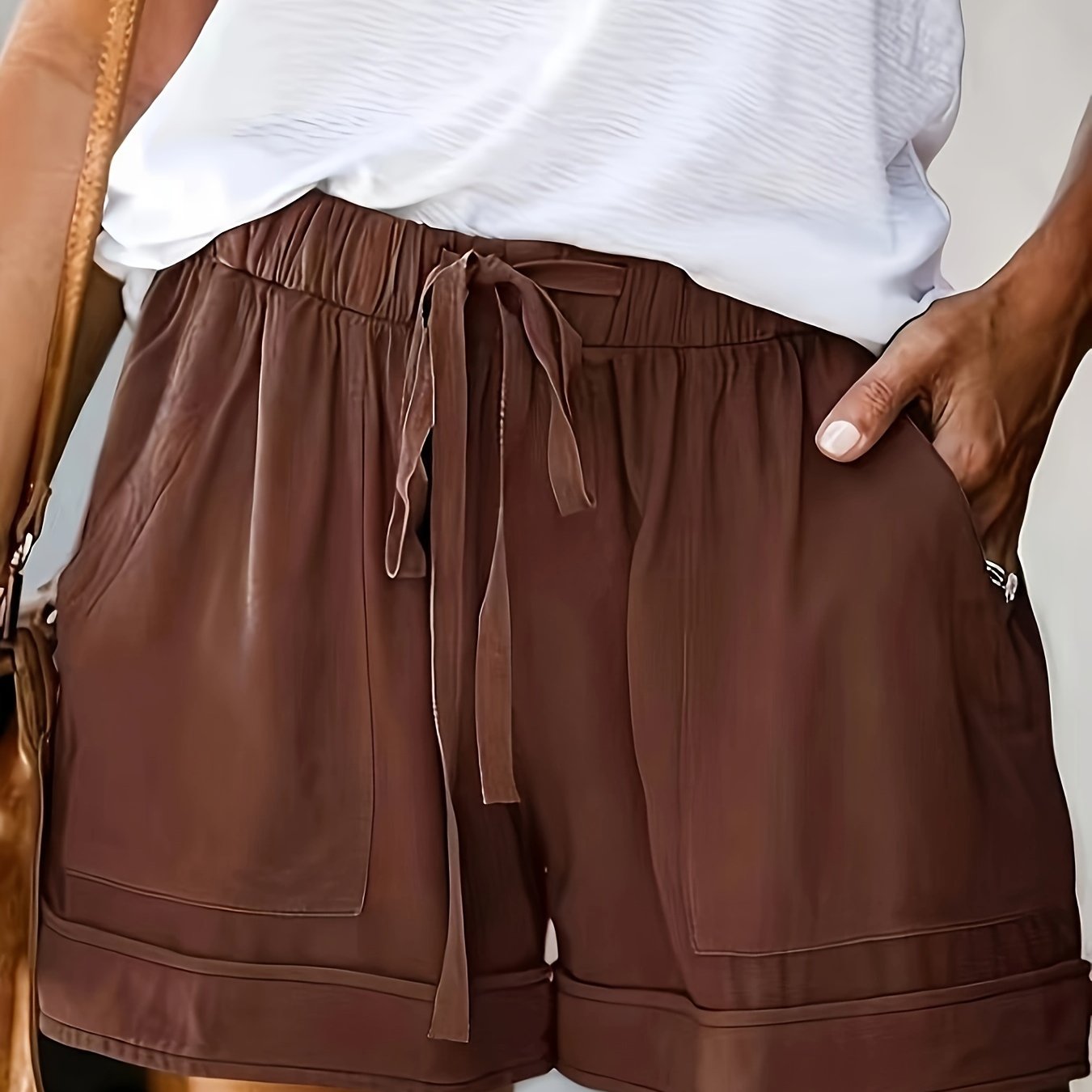 Polyester shorts for women with drawstring elastic waist, comfortable for summer. Made of 100% woven fabric.