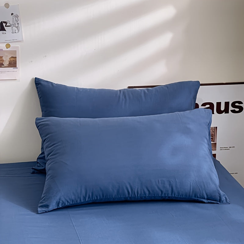 Enhance your bedroom, guest room, or hotel with our 2-piece set of solid color versatile pillowcases. Made from soft and breathable material with a frosted treatment, these pillowcases are conveniently machine washable. Available in three classic colors