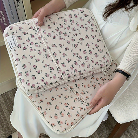 Pink floral laptop sleeve for 25.4-35.56 cm tablets and laptops made of kawaii polyester with pastel flower design. Ideal for office or school use. Laptop accessory with kawaii design and