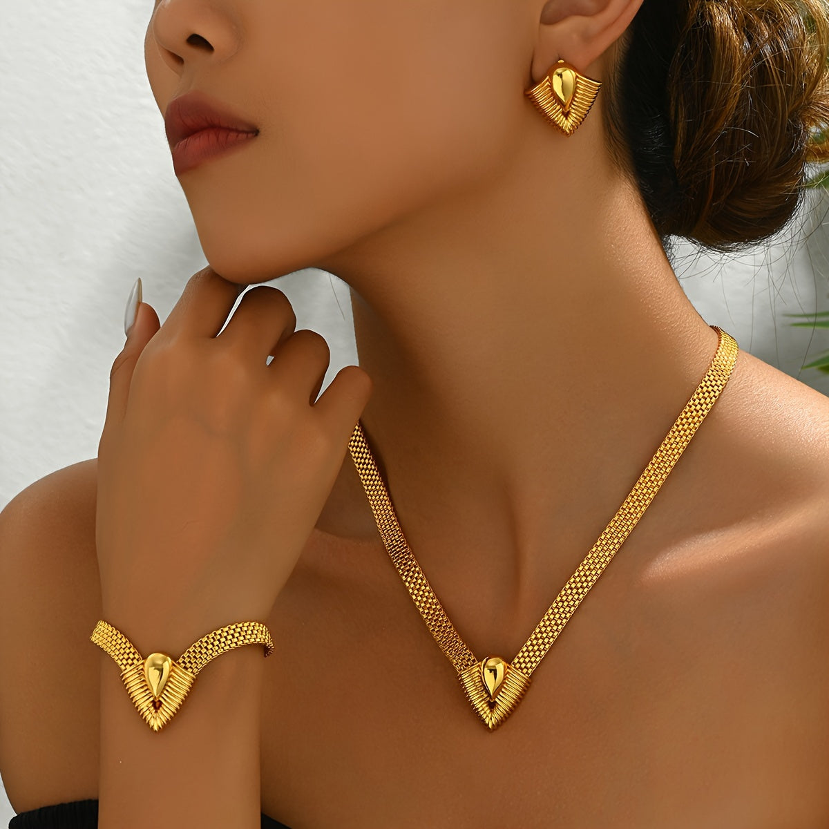 Set of 3 high-quality geometric V-shaped design jewelry pieces for women, including a necklace, bracelet, and earrings, all designed to accentuate the collarbone.