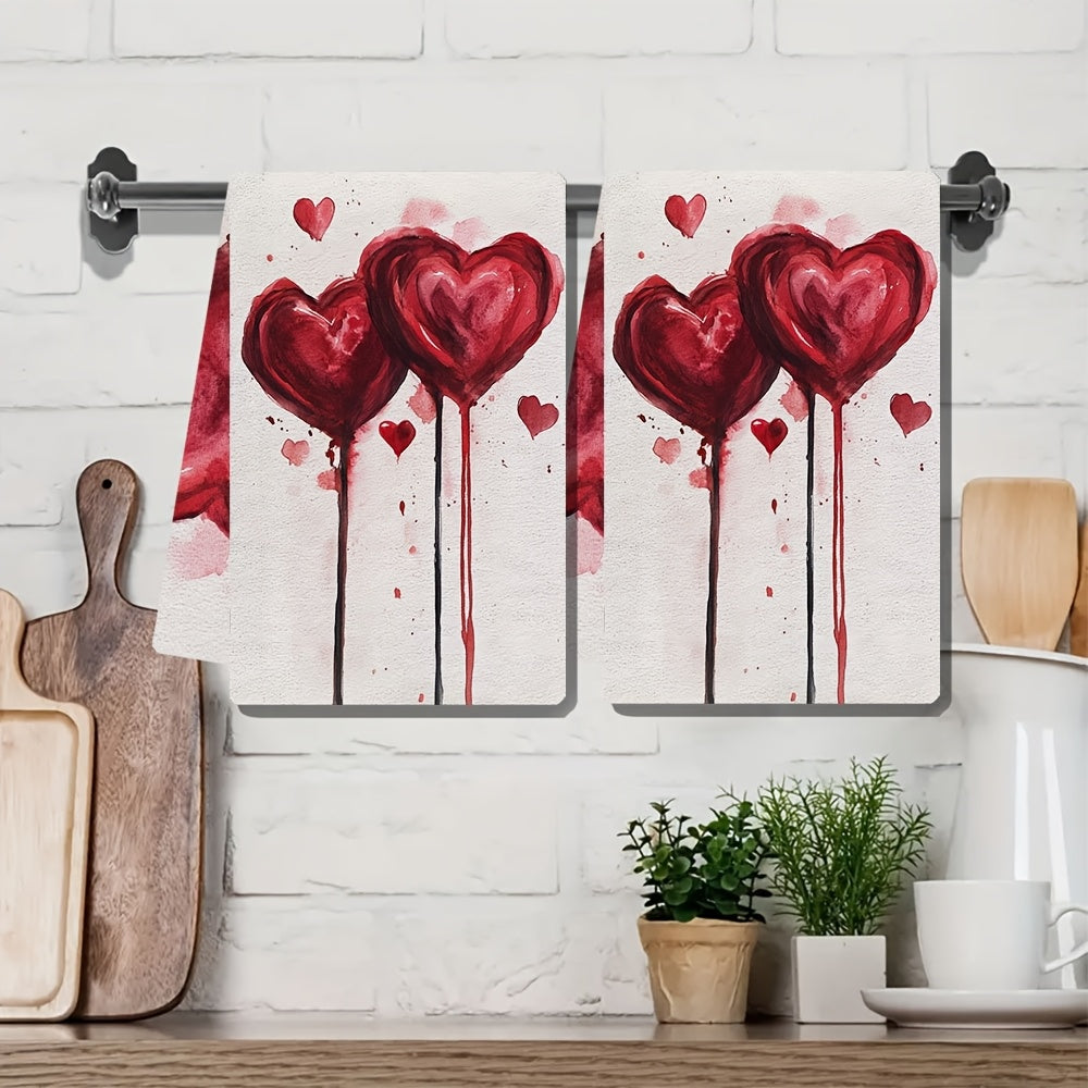 Two pieces of ultra soft kitchen towels featuring a Valentine's Vibes heart design. These towels are highly absorbent, machine washable, and perfect for drying dishes. With a contemporary style, they measure 40.64x60.96 cm each.