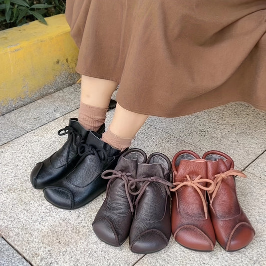 Soft plush-lined women's ankle boots in black, brown, and burgundy, with a cozy slip-on design.