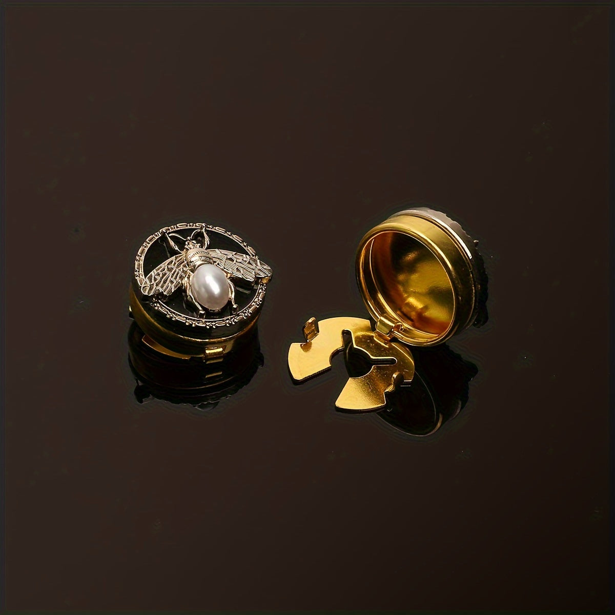 Get a pair of elegant Golden Bee cufflinks and shirt buttons set for a fashionable and seamless look. Made of shiny copper, these clip-on buttons are perfect for formal tailcoat attire and add a touch of luxurious decoration to your clothing. This fancy