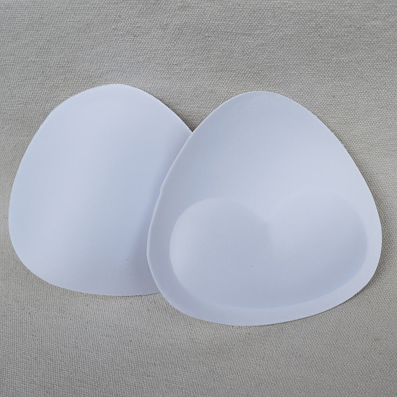 2 pairs of heart-shaped sponge bra inserts, washable and removable cup enhancers for bikinis, tops, and bras. Made from soft and breathable PU material for comfortable fit.