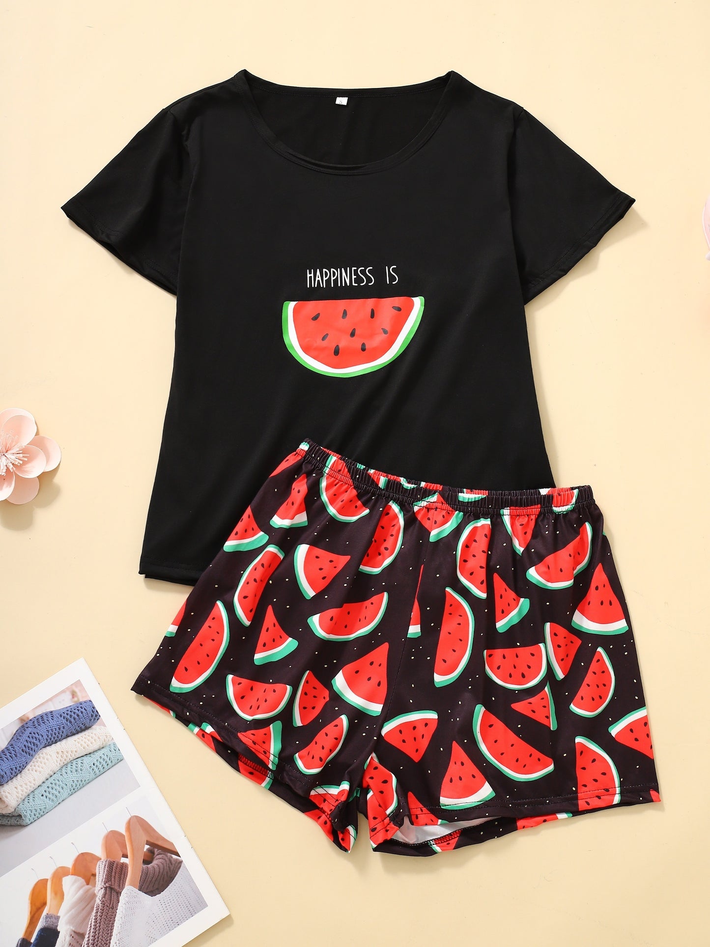 Women's loungewear set with watermelon and letter print, including short sleeve top and elastic shorts.