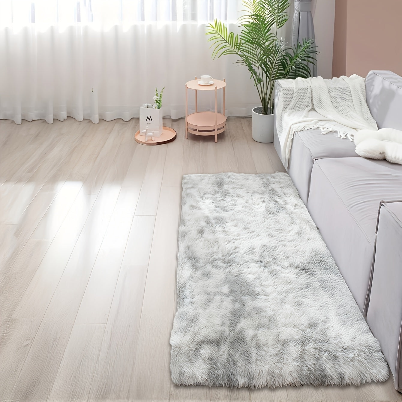 Soft and fluffy rectangle area rug perfect for your bedroom. This plush carpet is thick and non-slip, making it ideal for your living room. Made with machine-made polyester fiber, this low-pile rug is washable for easy cleaning. Perfect for indoor use.