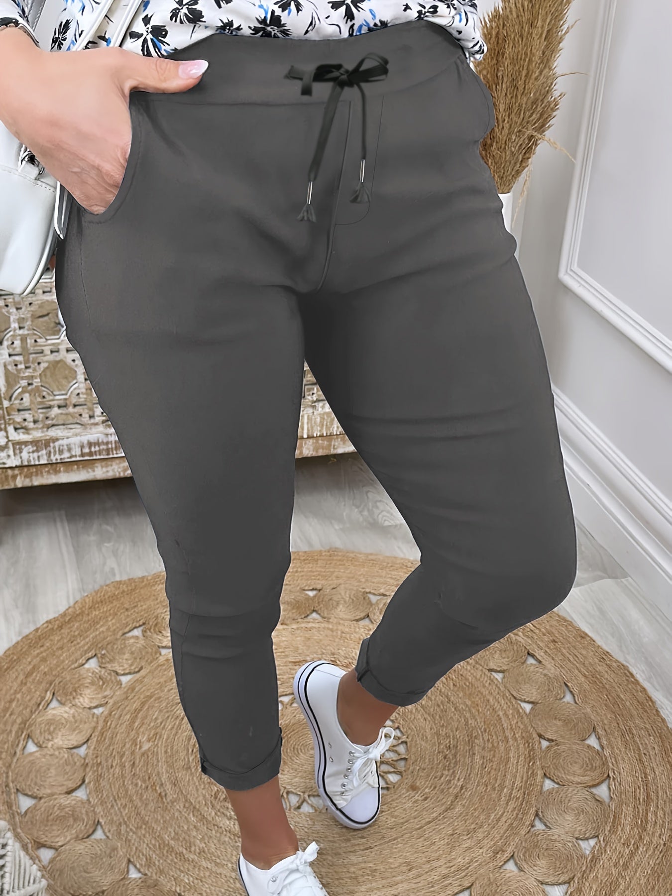 Women's comfortable jogger pants made of stretchy polyester with a drawstring waist, solid color, and machine washable for all-season wear.