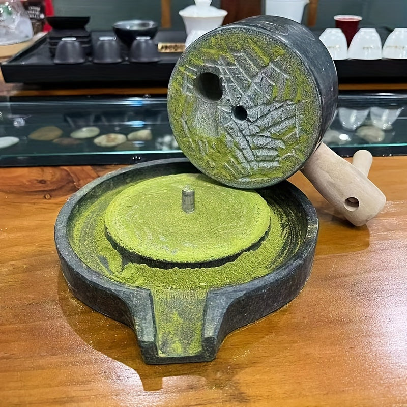 Handcrafted bluestone grinder for tea, coffee, and pepper, along with a matching handmade tea set and stone grinder for matcha. A perfect addition to any household's collection of tea grinding utensils, complete with beautiful graphite ornaments.