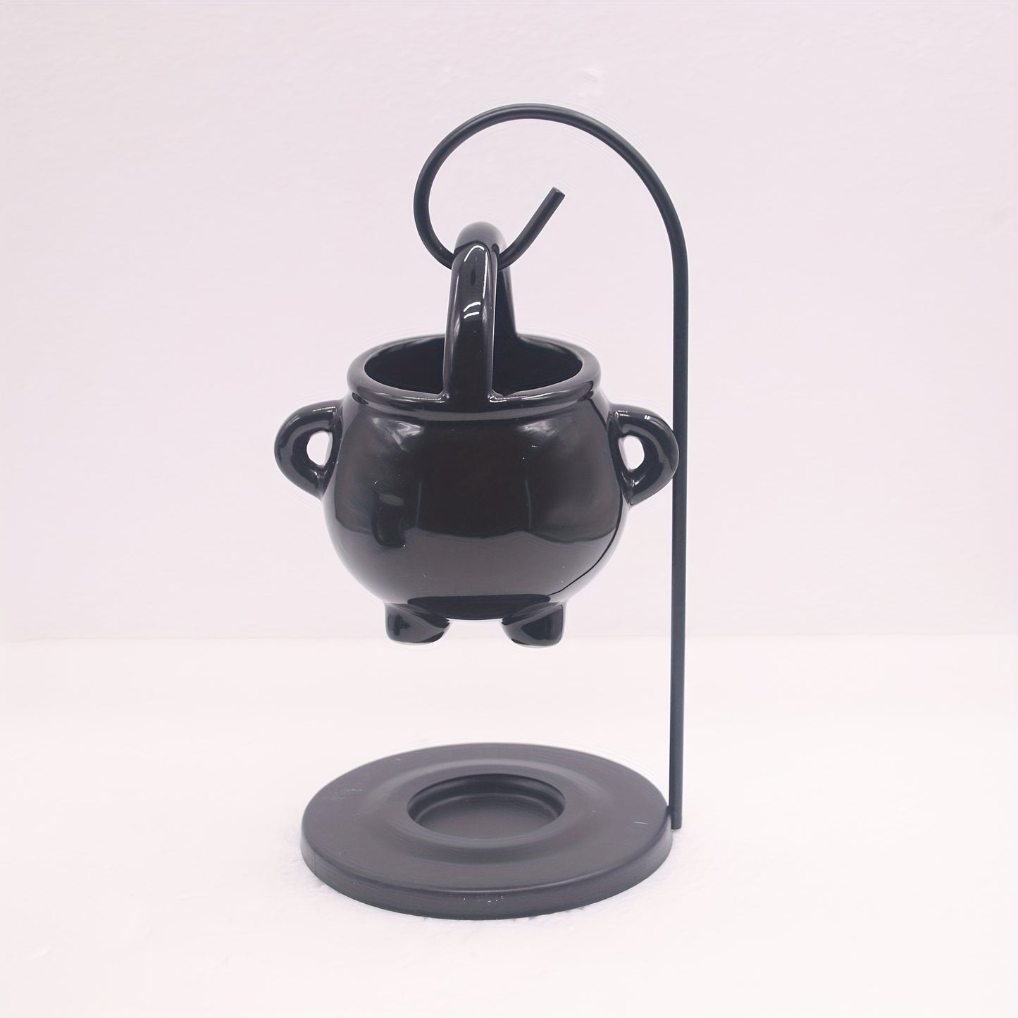 Black ceramic cauldron oil burner with iron holder, glossy finish, aroma diffuser and wax melt warmer, tealight candle holder for home decor. No incense needed.