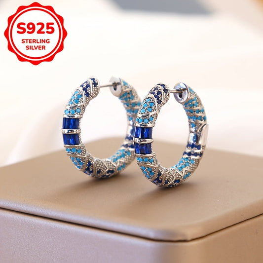 Vintage Tribal Style Hoop Earrings featuring Synthetic Blue Cubic Zirconia, set in 925 Sterling Silver. Perfect for both daily wear and special banquet occasions, these earrings are a stunning representation of the December birthstone.