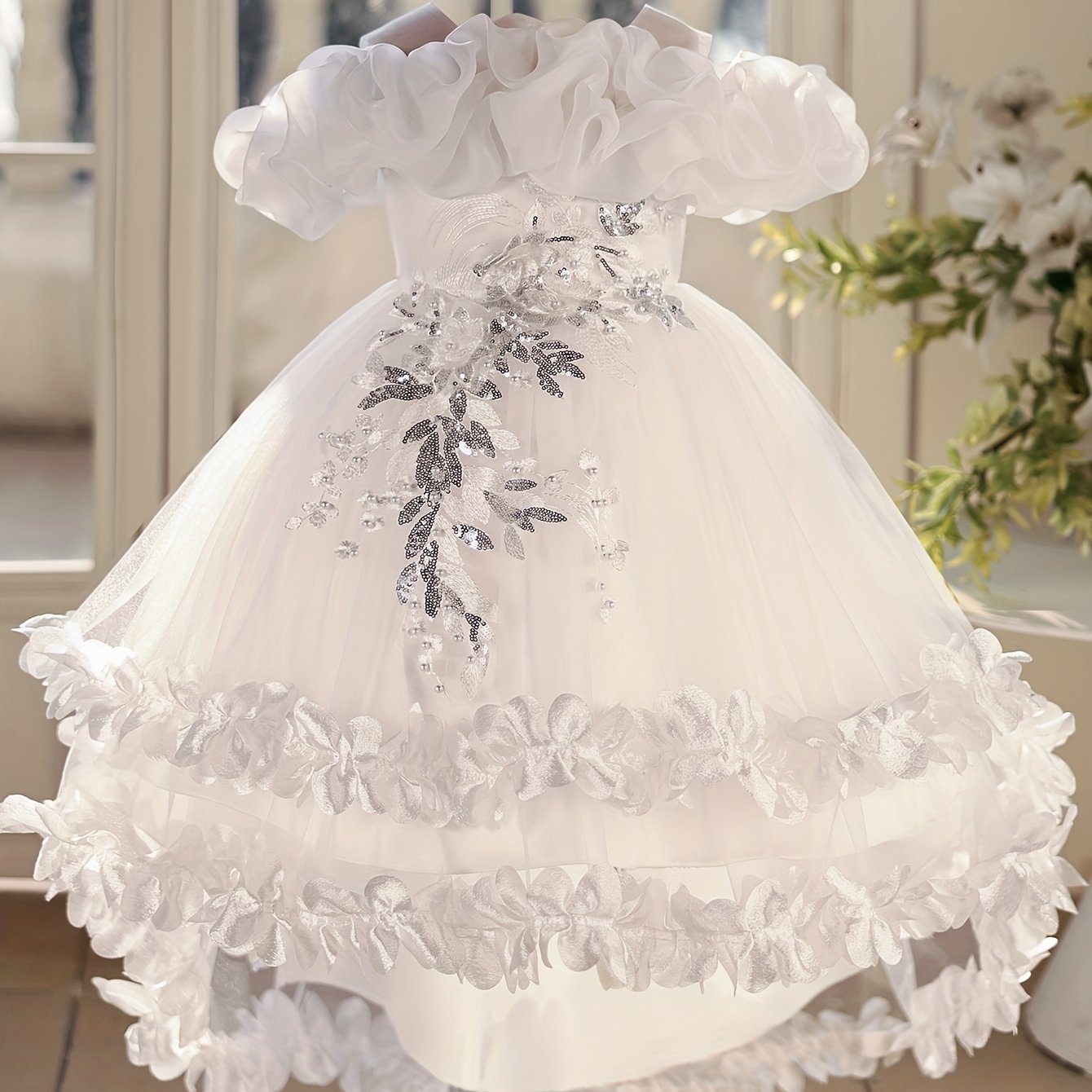 Sleeveless princess dress for girls with high-low hem, floral appliques, belt detail, and breathable polyester blend.