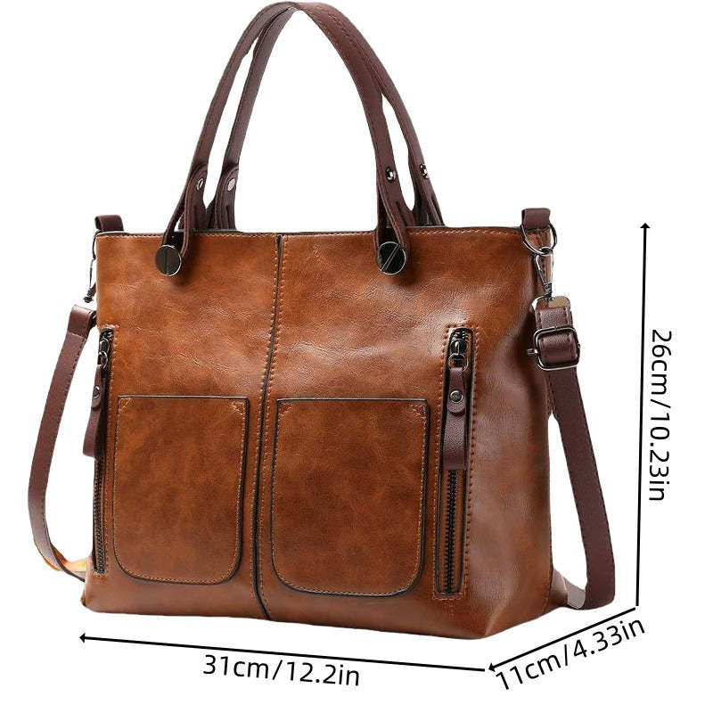 Vintage-style women's tote bag with adjustable strap, large capacity, multiple pockets, zipper closure, deep brown.