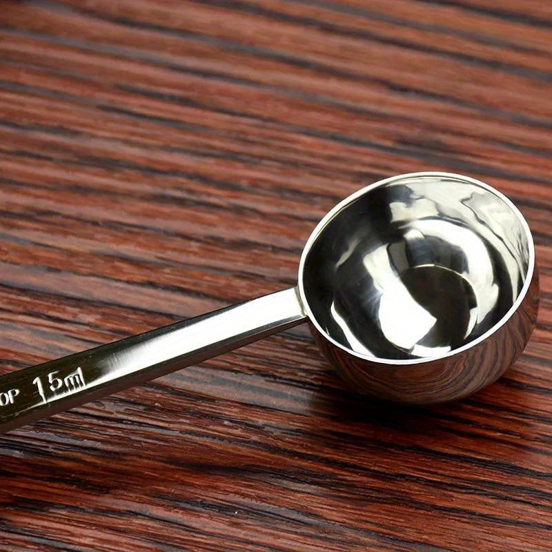 Set of 1 durable stainless steel measuring spoons for coffee, including a metal tablespoon coffee scoop. This kitchen baking tool accessory is built to last.