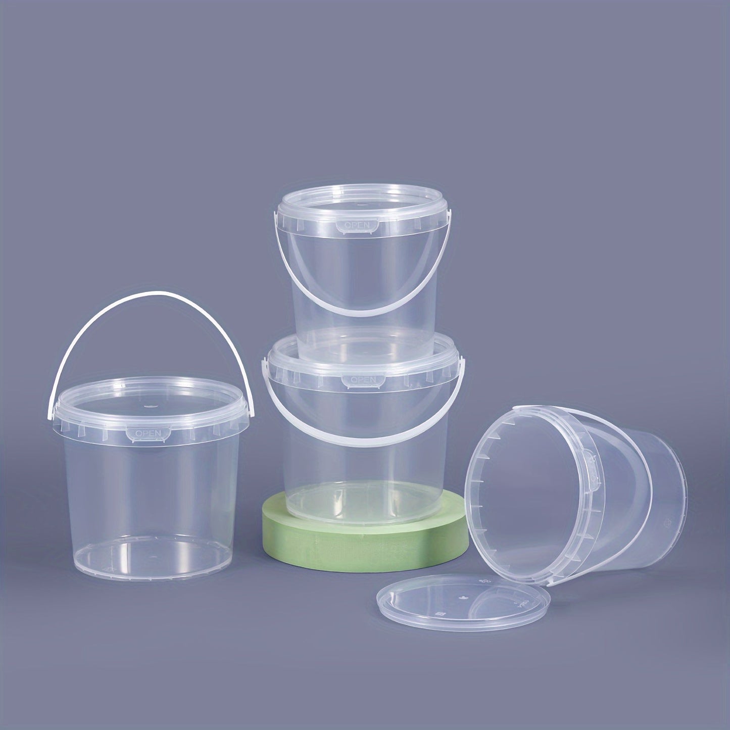 12-piece set of clear round PP Plastic Food Storage Containers with handles, ranging from 300ml to 1000ml in capacity. These containers are durable, resistant to high temperatures, odor-free, and safe for use in the microwave and freezer. They are also