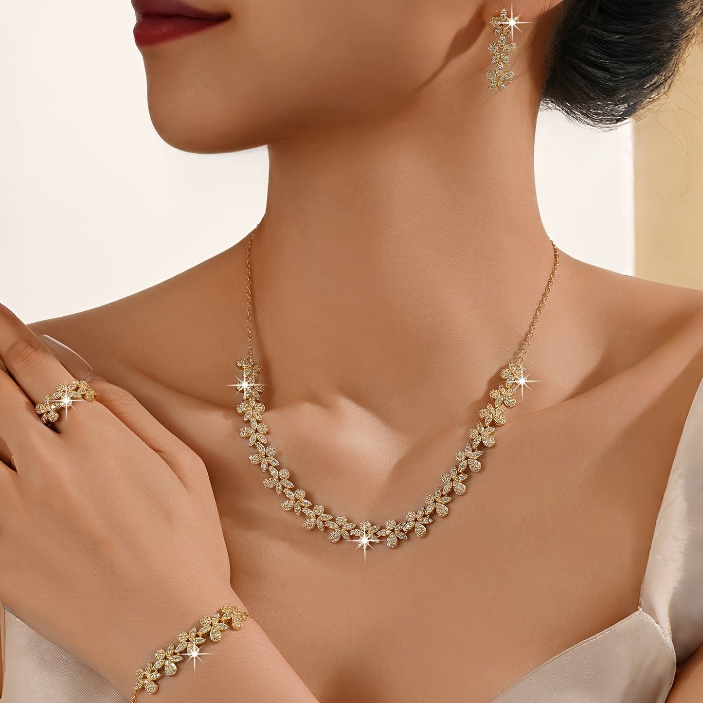 Luxurious Bridal Jewelry Set with Synthetic Zirconia, featuring a Stunning Flower Petal Design in 18K Gold Plating - Includes Necklace, Bracelet, Earrings, and Ring perfect for Wedding and Party Events. Made with Copper Base for utmost quality and