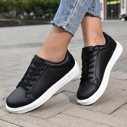 Black lace-up sneakers for women, versatile and comfortable for outdoor activities.