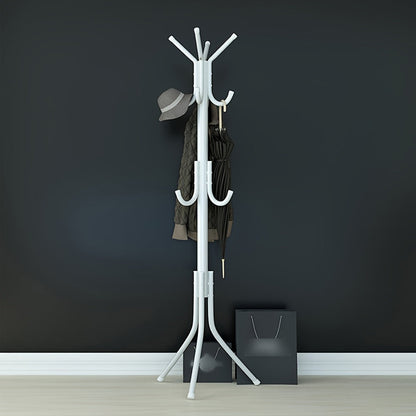 Multi-purpose, freestanding black metal coat rack with tree-style design for hanging clothes and hats in the bedroom.