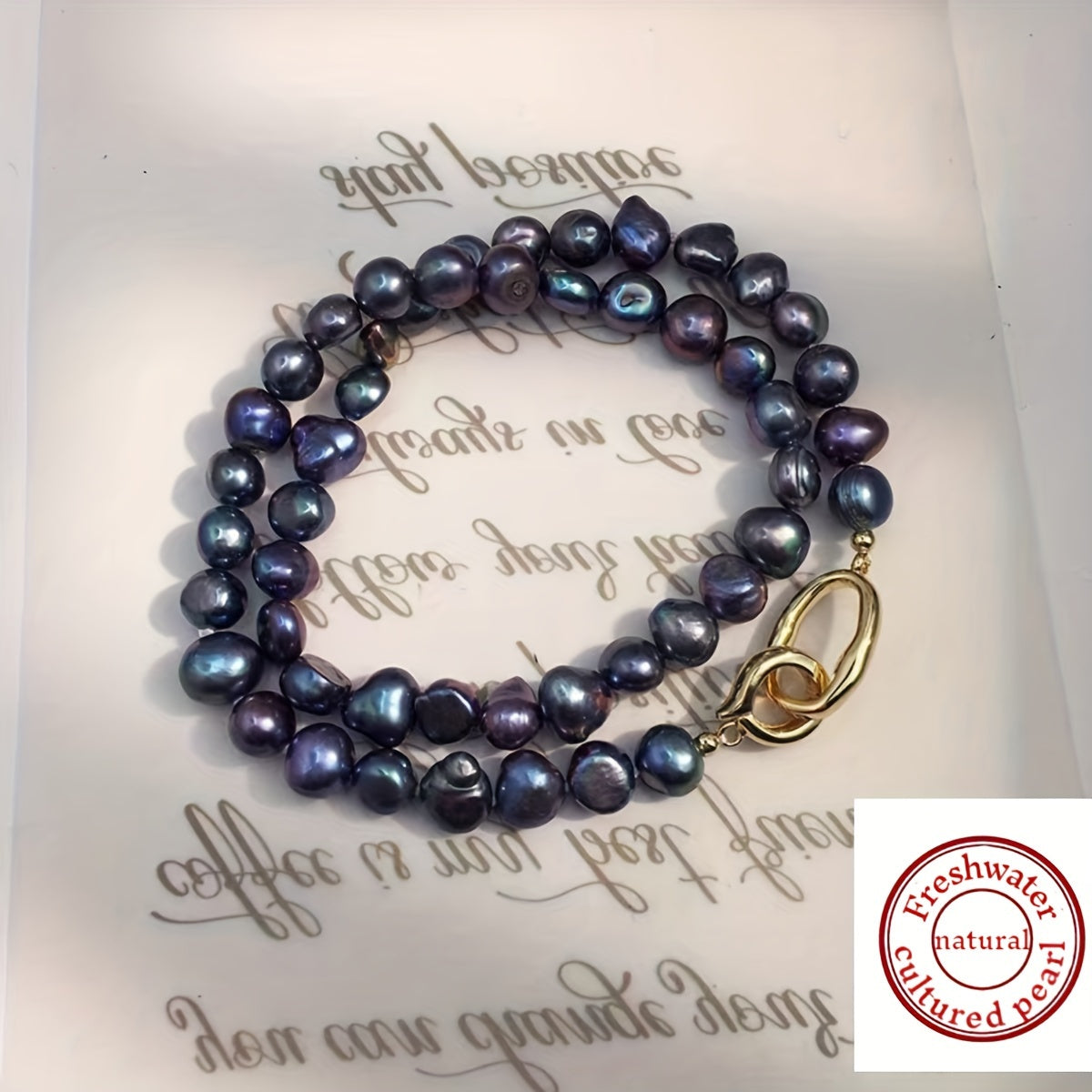 This necklace features a beautiful, natural freshwater cultured pearl measuring 7-9MM in a stunning blue-black hue. The clavicle length necklace is designed for women and showcases irregular baroque pearls with a unique texture and shape. Each pearl is