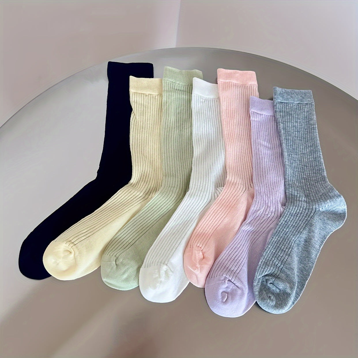 4 pairs of comfy mid-tube socks for women, with hollow out design for breathability.