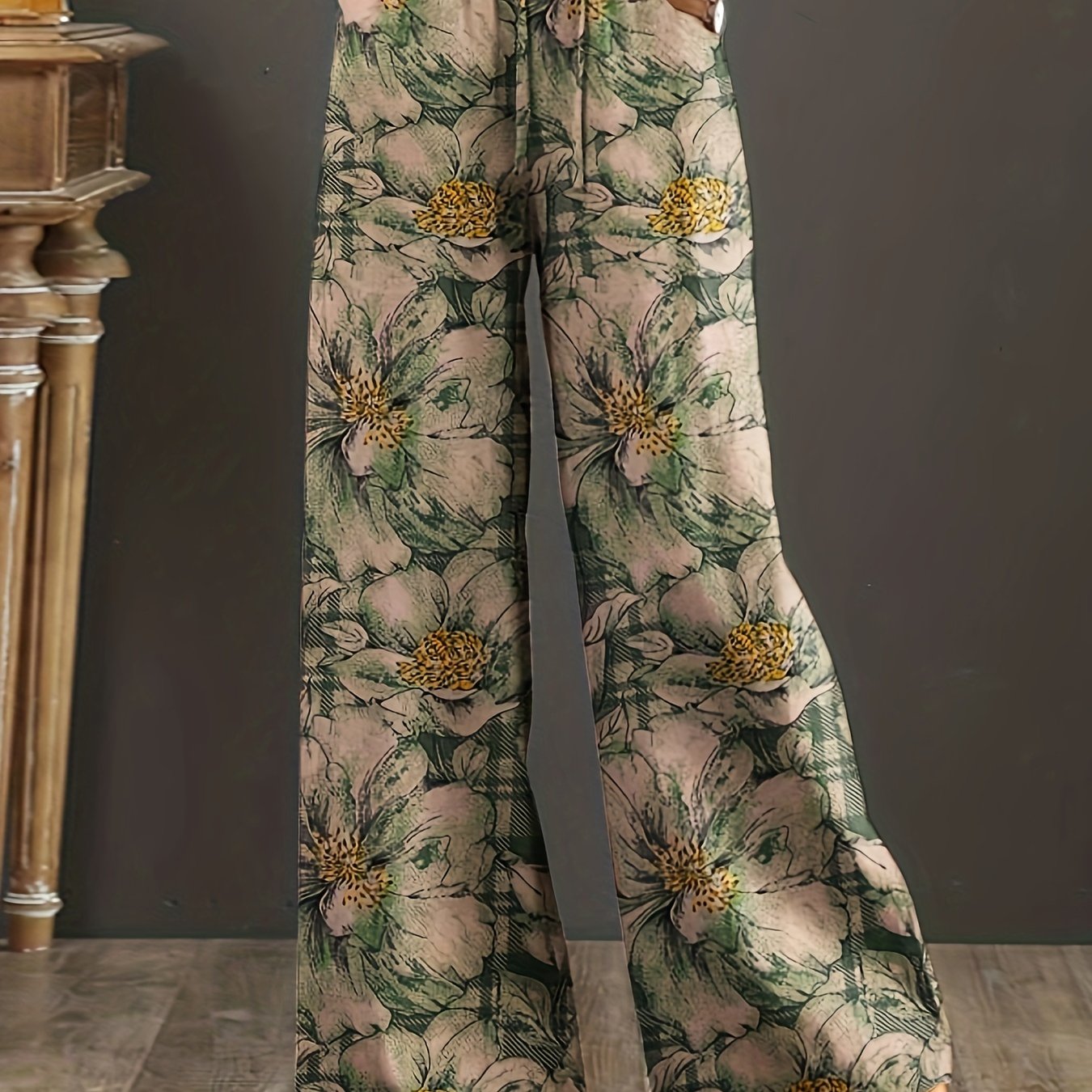 Floral cotton wide-leg pants with elastic waist, lace-up detail, and loose fit. Perfect for casual weekends and year-round comfort. Made with woven fabric for adults.