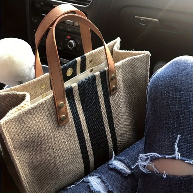 Durable and stylish striped canvas tote bag for women, perfect for work, school, and travel. Features soft handles and spacious interior with beige & black striped design. Built to last.