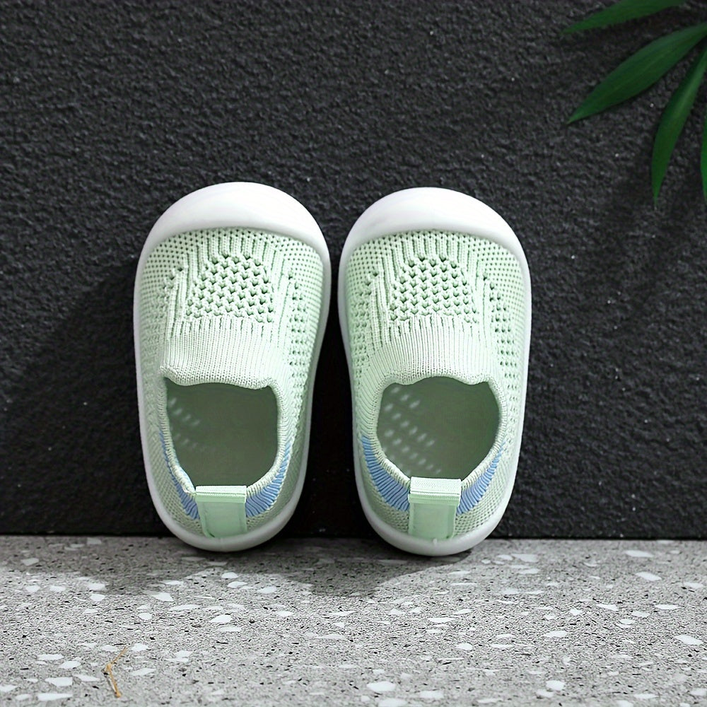 Soft infant walking shoes for toddlers made with knitted fabric.