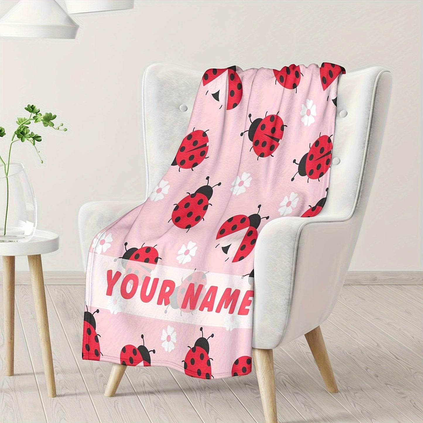 Customize your very own ladybug throw blanket with a personalized name. Made with lightweight flannel fleece, perfect for the sofa, bed, travel, camping, living room, or office chair. This contemporary style blanket is machine washable and suitable for