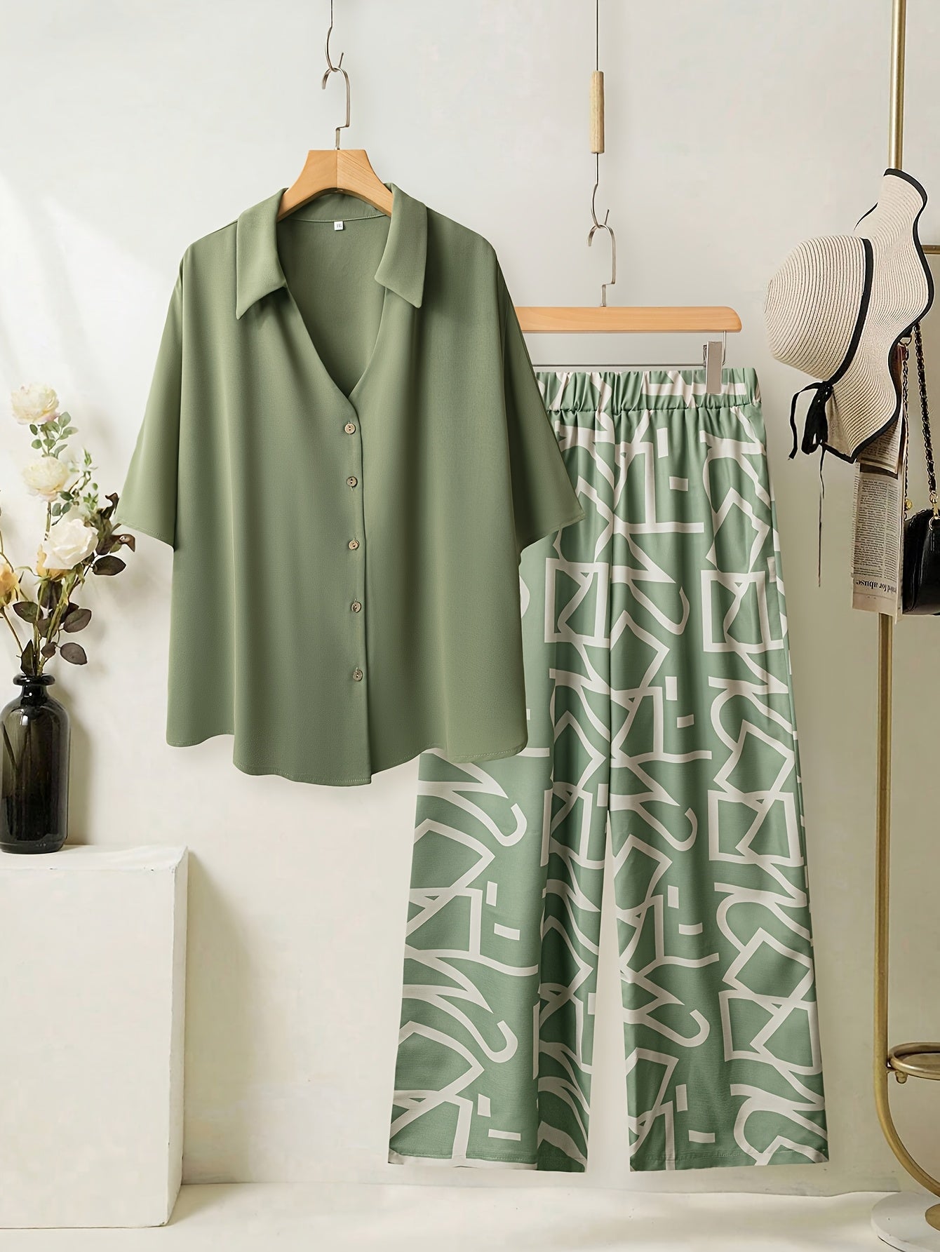 Women's large size elegant two-piece set - shirt and pants.