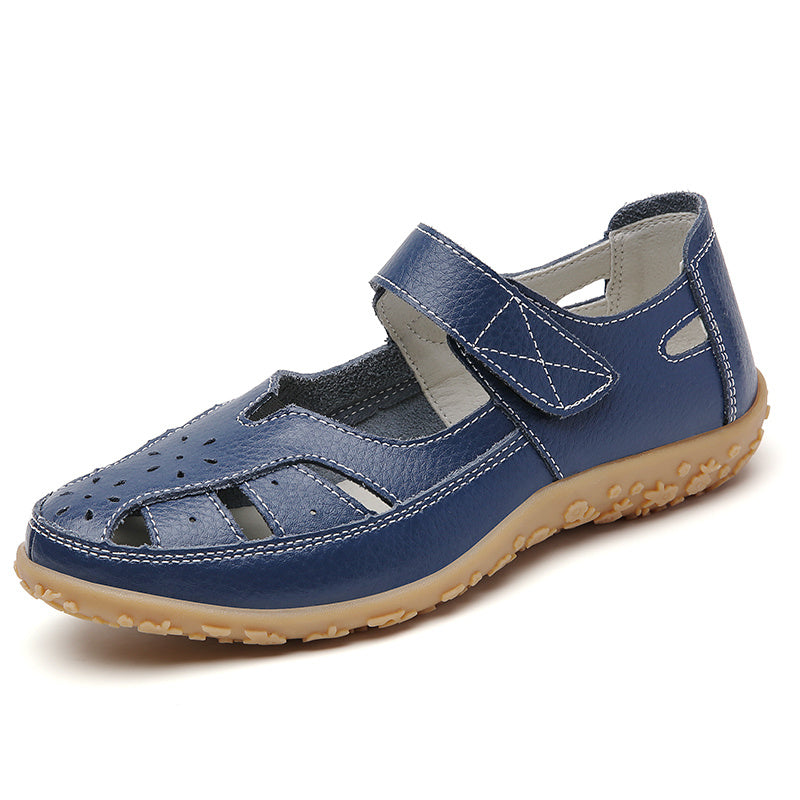 Cut-out flat sandals for women with soft soles and hook & loop closures, ideal for casual walking with their non-slip closed-toe design.