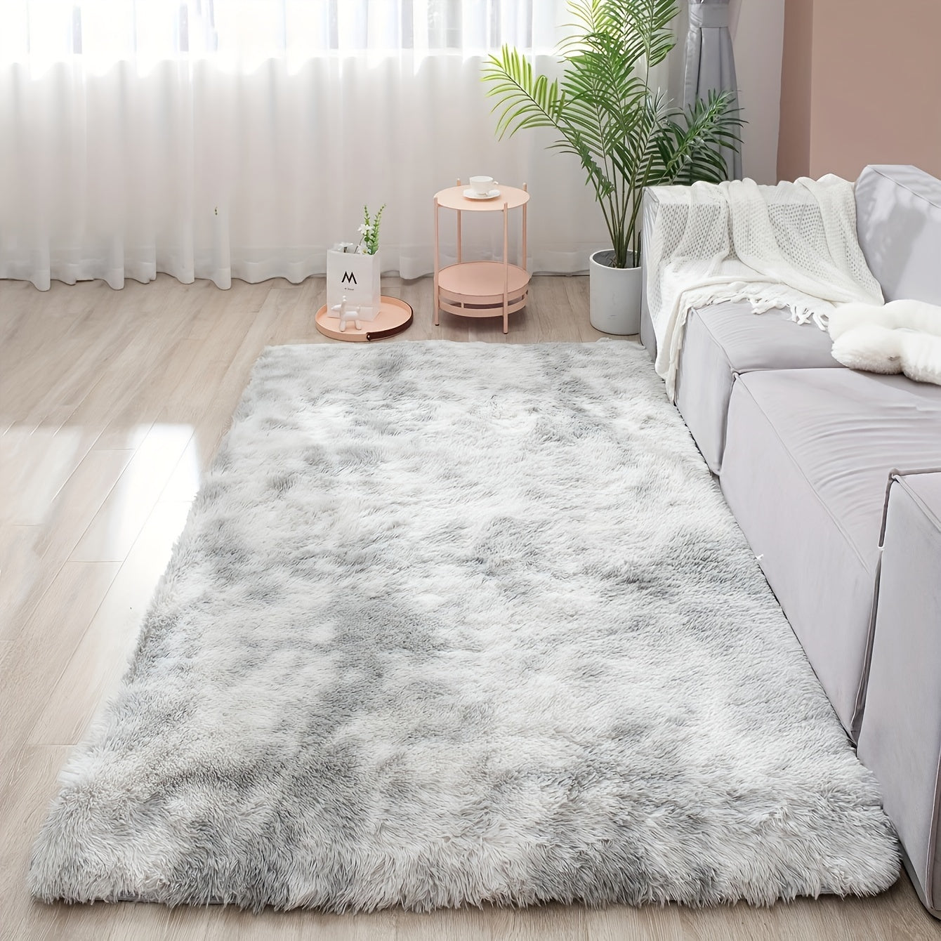 Soft and fluffy rectangle area rug perfect for your bedroom. This plush carpet is thick and non-slip, making it ideal for your living room. Made with machine-made polyester fiber, this low-pile rug is washable for easy cleaning. Perfect for indoor use.