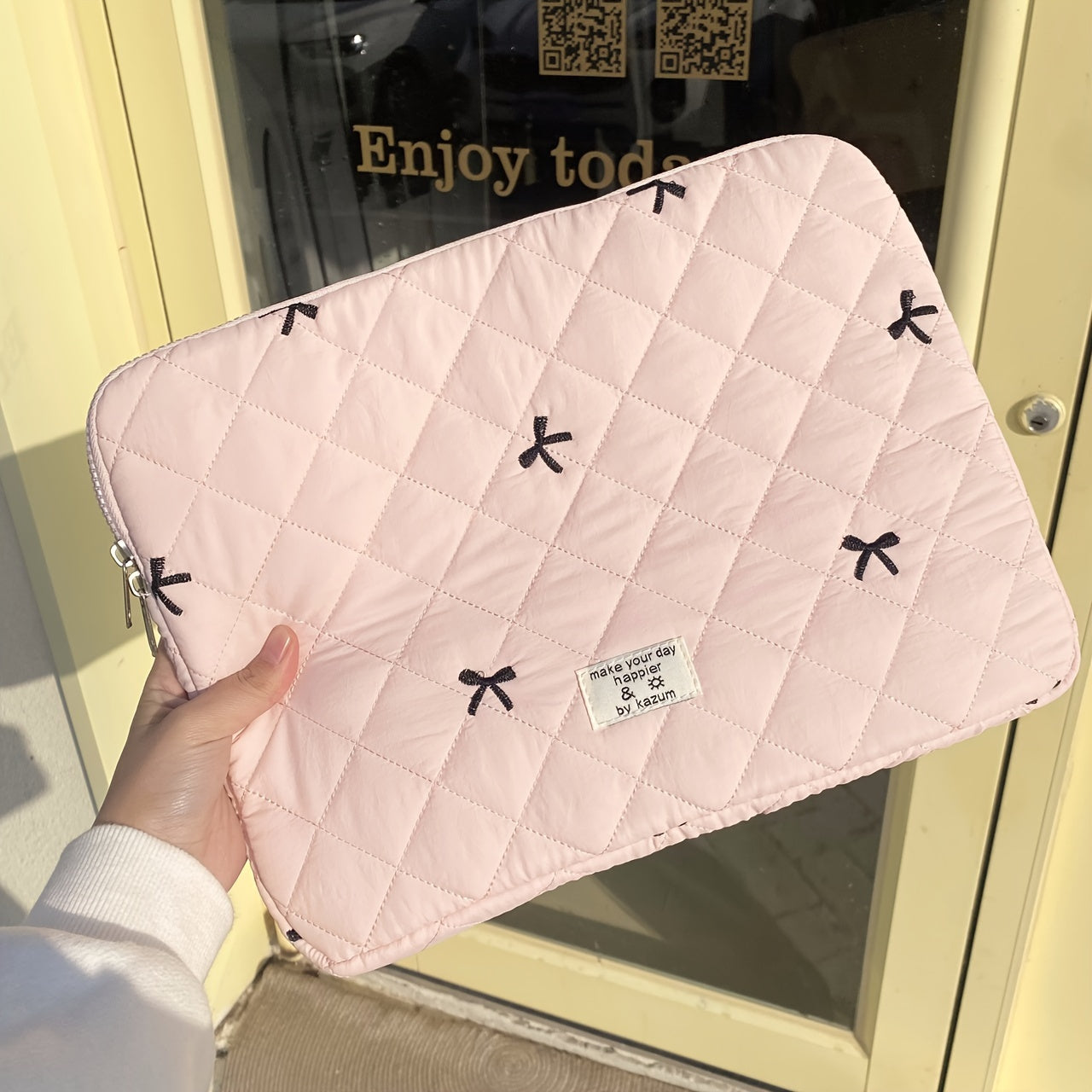 One laptop bag with ballet style bow embroidery, suitable for various devices.