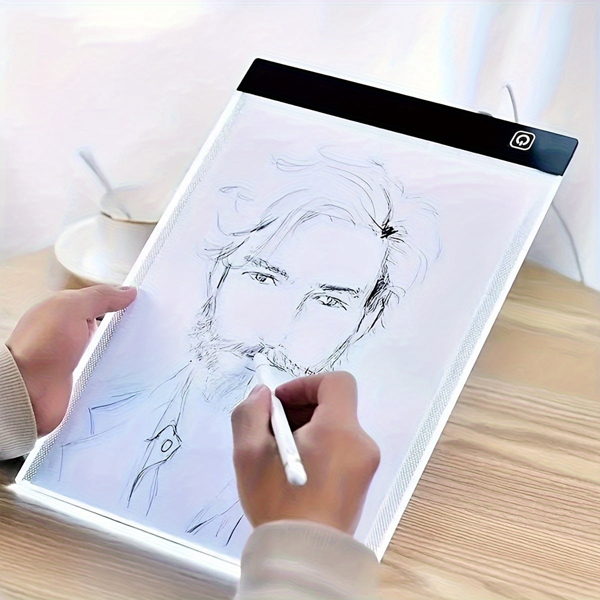 Thin, portable LED tracing light pad ideal for art, tattoo, drawing, sketching, animation, and stenciling. Adjustable brightness, USB powered, acrylic material. Perfect for detailed artwork