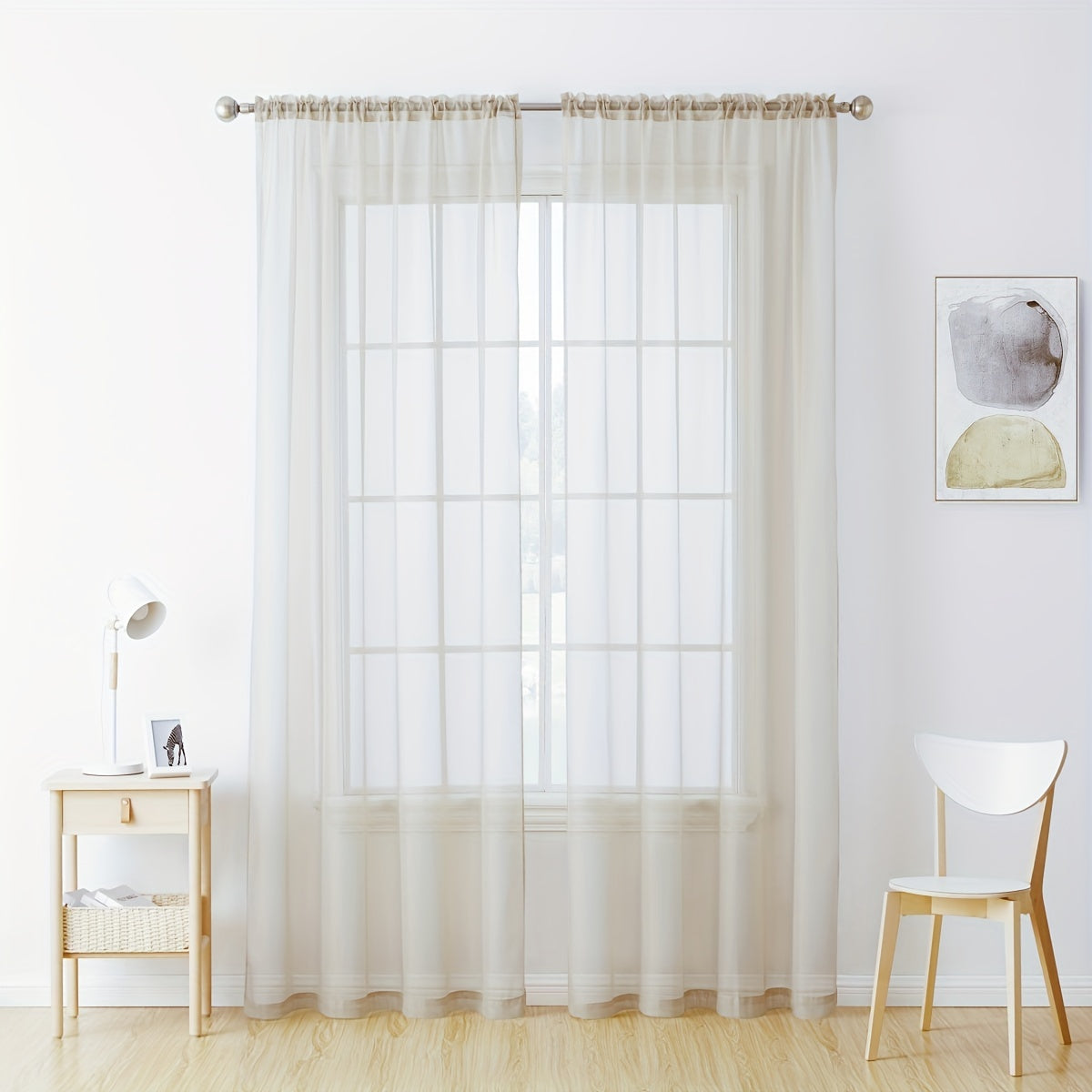 Enhance your decor with these elegant sheer voile curtain panels. Made of semi-transparent polyester, they feature a rod pocket design for easy hanging in your kitchen, bedroom, or living room. Create a romantic ambiance with these beautiful curtains.