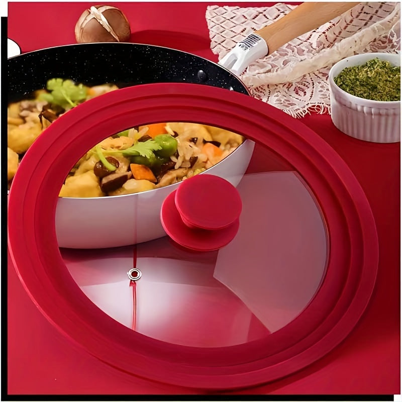 Multi-functional red silicone-rimmed glass lid designed for pots and skillets from 20.32cm to 27.94cm in diameter - can be safely cleaned in the dishwasher, features a non-slip knob, and is heat resistant.