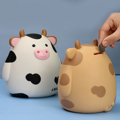 Cute cow-shaped penny bank, perfect for saving money and as a creative gift for birthdays and Christmas. Made of non-waterproof PVC with latch closure, ideal for desk decor.