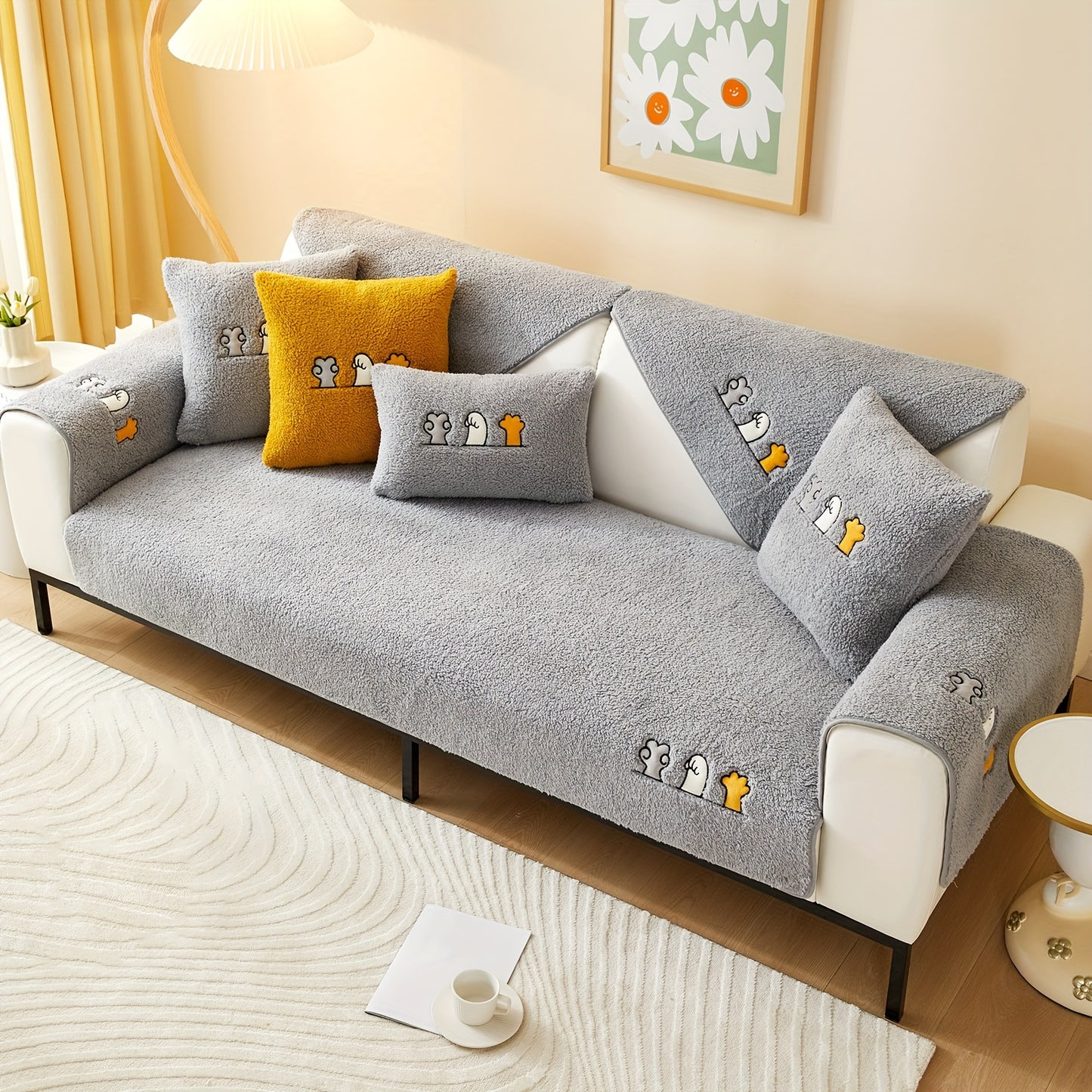 Modern plush sofa cover with paw pattern embroidery, non-slip protection for sofas, machine washable and suitable for various types of furniture.