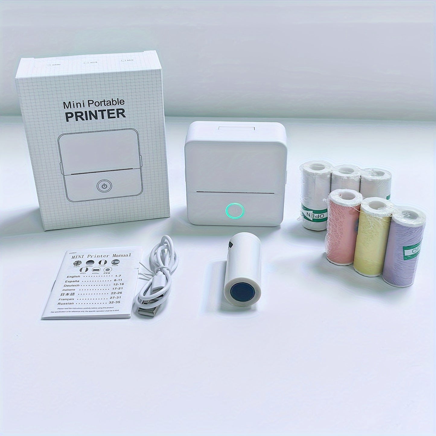 Mini portable thermal wireless pocket printer with a variety of self-adhesive sticker rolls for printing pictures, photos, labels, text, and more.