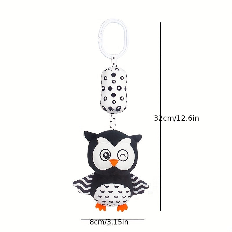 Black and white rattle wind chime for visual training in babies, perfect for early education and development. Makes a great gift for babies and toddlers.