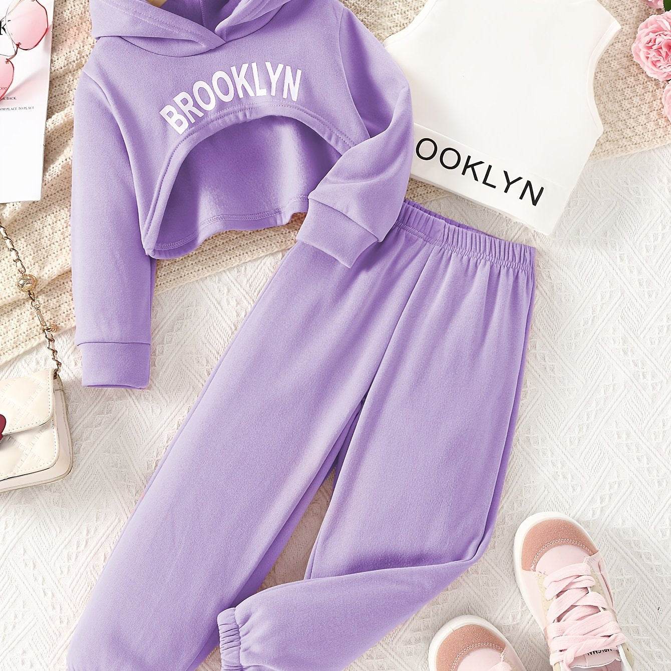 Stylish girls' outdoor clothing set for spring and autumn includes a hooded sweatshirt, vest, and pants with letter print. Perfect for casual or special occasions.