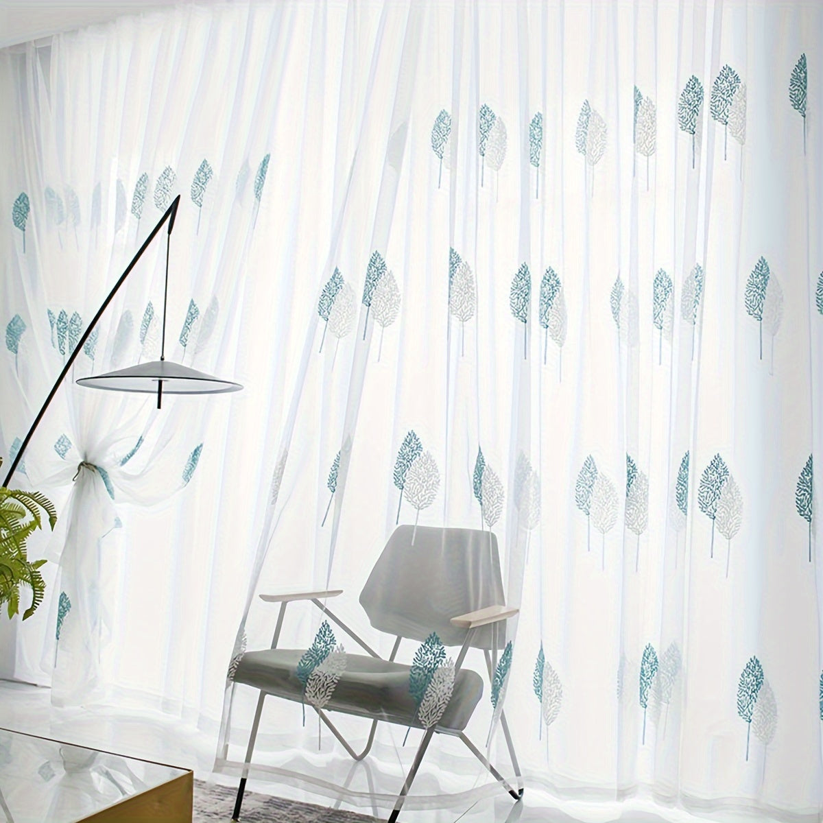 Add a touch of pastoral elegance to your home with this beautiful sheer curtain featuring delicate leaf embroidery. This translucent tulle curtain is easy to hang with a rod pocket design, perfect for adding a subtle touch of style to your living room or