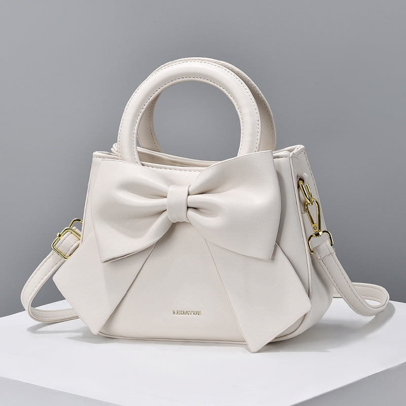 Solid color bow zipper small bag for ladies