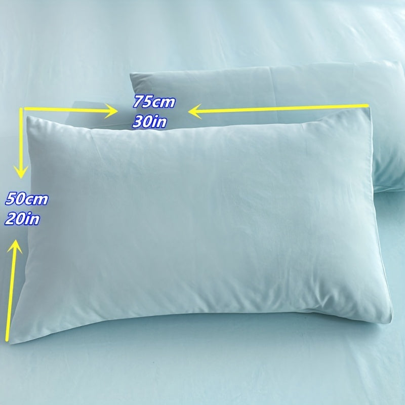 Two polyester pillowcases for bedroom use, featuring a multi-colored solid design.