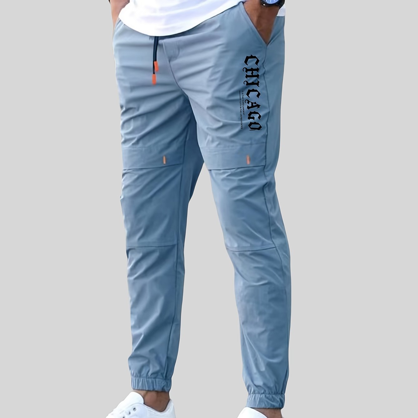 Men's casual joggers made of 100% polyester non-stretch woven fabric with alphabet print detail, suitable for all seasons and featuring a regular fit.