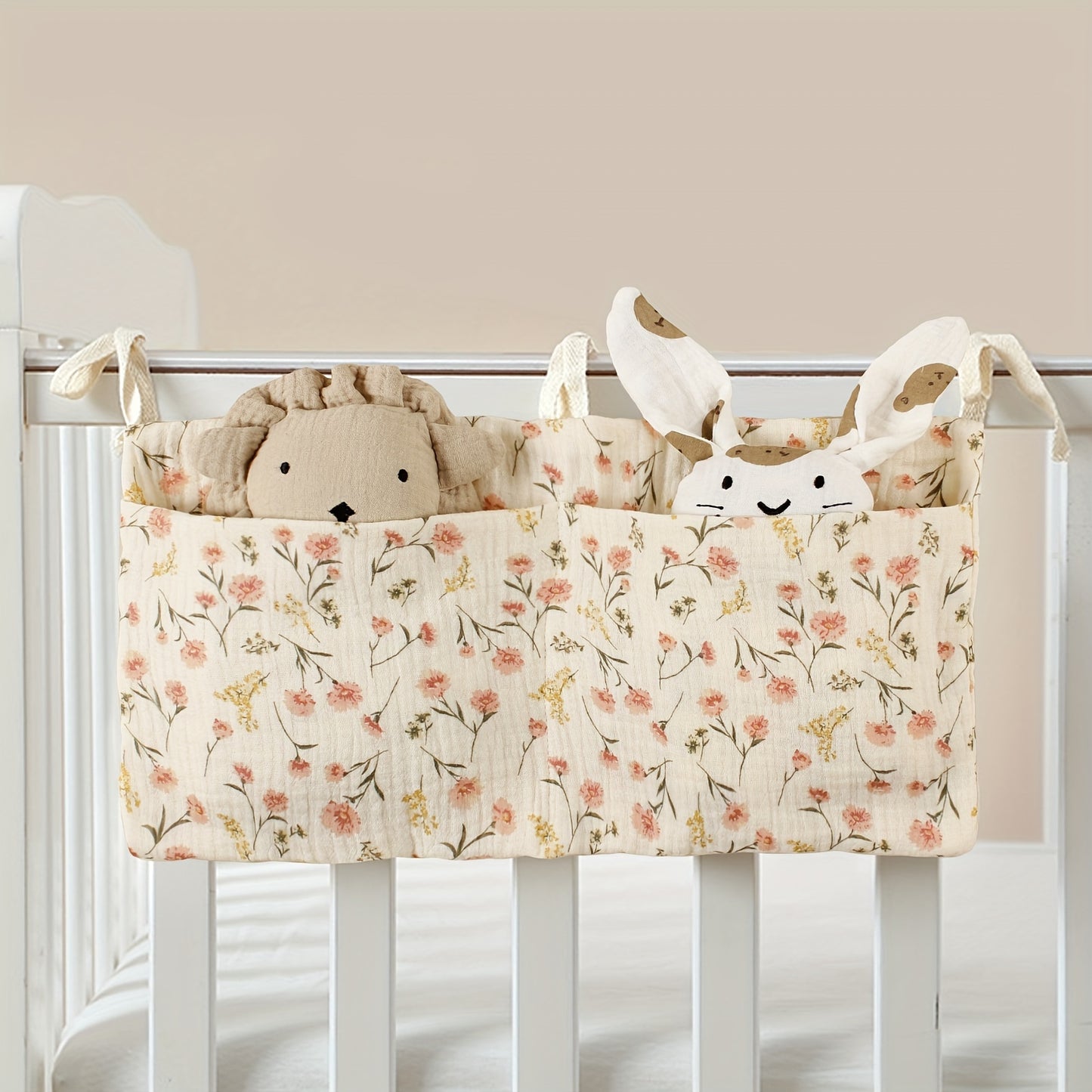 Double-layer fabric hanging storage bag with two stroller pockets, ideal for holding baby bottles with printed patterns.