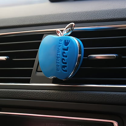 Apple-shaped car air freshener with aromatherapy perfume diffuser and vent clip fragrance dispenser. Includes balm/tablet/incense stick for portable auto scent enhancement.